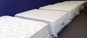 new mattresses lined up at Mattress By Appointment Quad Cities