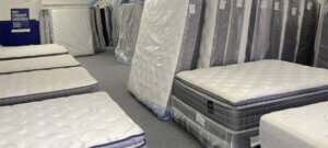 new mattresses lined up at Mattress By Appointment Quad Cities